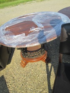 Round 48in carved wood and scrollin...