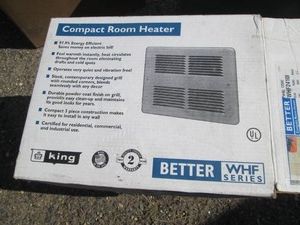 Compact room heater in original box...