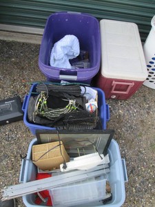 Trio of storage totes with baskets ...