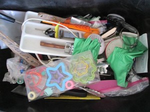 Storage tote loaded with various ki...