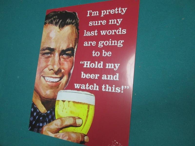 Beer metal sign measures 12 x 16 in...