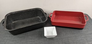 Red Bobby Flay Stoneware Bakeware, Crate & Barrel White Bowl, and Black Roasting Pan