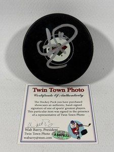 Jason Zucker autographed Minnesota Wild hockey puck with authentication