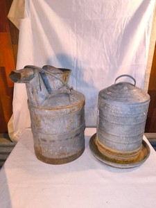 Vintage galvanized steel gas transfer can and galvanized poultry feeder