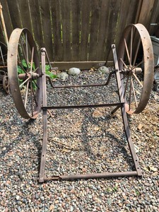 Antique two wheeled metal cart frame
