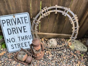Metal salvage pieces and Sign