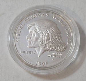 1995P  Silver One Dollar Round - US Proof commemorating the Special Olympic World Games    - this is the first US Coin to portray a living woman (Eunice Kennedy Shriver) the founder. (1 Oz. Round 90% Silver)