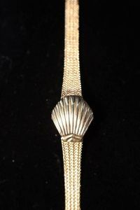Vintage Ingersoll Quartz Watch with Concealed Dial and Shell Cover