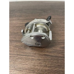 Shimano Silver Metal Baitcasting Reel with Dual Handles