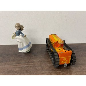 Nao Porcelain Girl Figurine and Tin Track Vehicle 2 Pieces