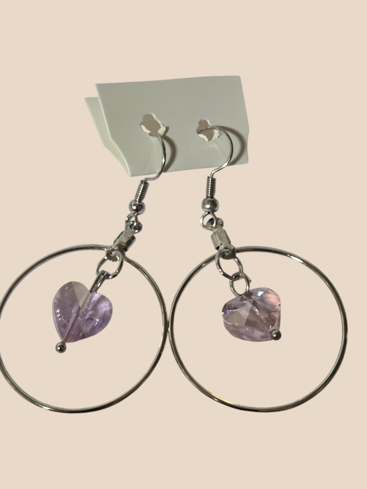 Large Silver-Tone Hoop Earrings with Pink Faceted Heart Dangles