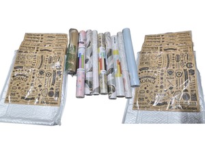 mixed supplies including 12 packs of wax paper sheets(1,200 sheets total).