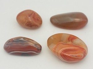 Four (4) genuine Sardonyx Palm Stones. Expertly cut and polished to a brilliant, glassy sheen. (9.3 oz  264 g)