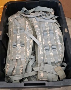 TOTE FULL OF WAIST BELTS FOR LARGER RUCKSACKS