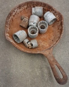SMALL VINTAGE CAST IRON PAN WITH MISC SIZED SOCKETS