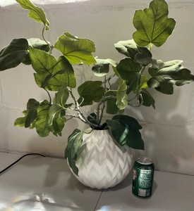 Neutral textured white vase with artificial fig leaf arrangement