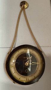 Repaired vintage Mercator hanging wall clock, dark wooden rim, gold toned radial dial