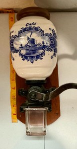 Vintage wall mounted Coffee grinder with classic blue and white delft porcelain hopper, Dutch windmill scene