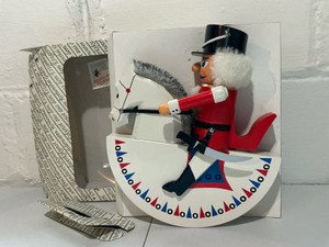 Erzgebirge wooden nutcracker Reiterlein (Horseman hussar0 in red mounted on a rocking horse