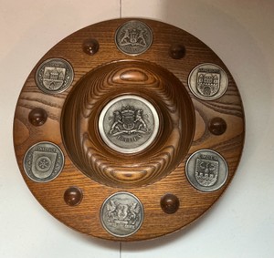 Vintage handcrafted German wooden wall plate with pewter medallions of German city coats of arms
