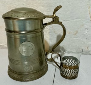 Vintage metal lidded tankard and matching glass holder, classic brass or pewter toned finish
