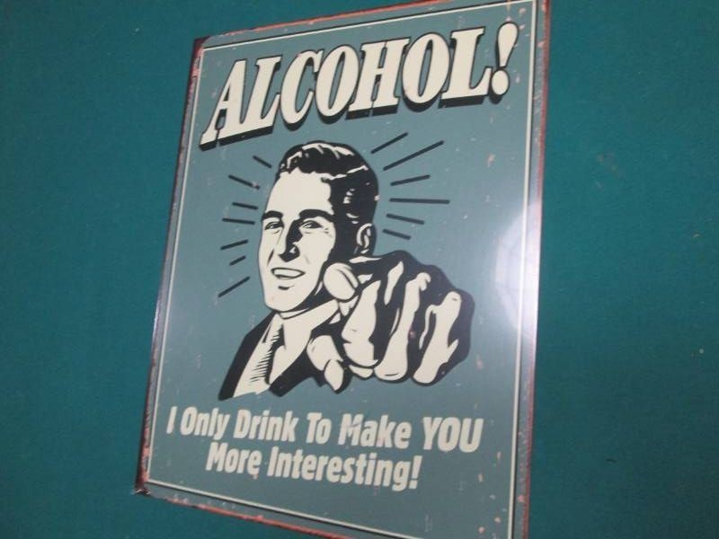 Alcohol metal sign measures 12 x 16...