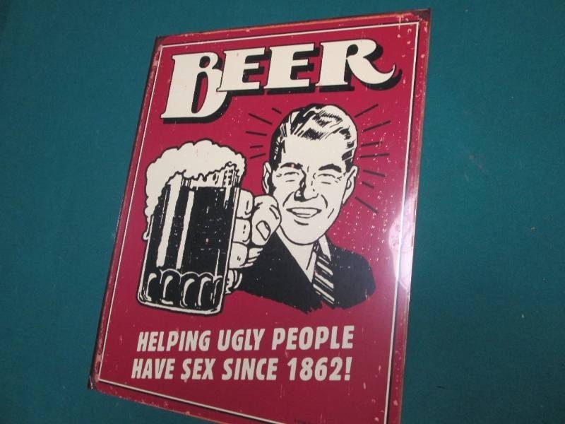 Beer metal sign measures 12 x 16 in...