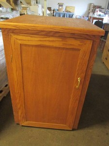Oak storage cabinet top is 31 x 31 and 47 tall