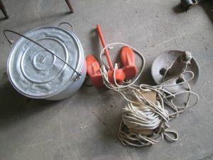 2 Boat anchors and a metal pail with lid