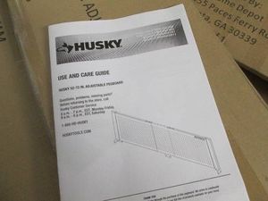 Husky black metal 52 -72 adjustable pegboard