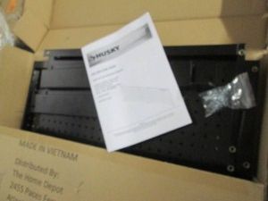 Husky black metal 52 -72 adjustable pegboard