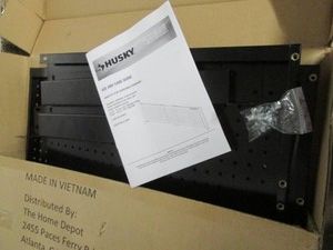 Husky black metal 52 -72 adjustable pegboard