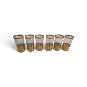 Valued at $175 set of vintage mid-century modern Culver Antigua highball glasses featuring a textured 22-karat gold overlay and raised oval window panels