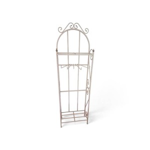 vintage cream-colored metal scrollwork freestanding towel, quilt, or garment organizer