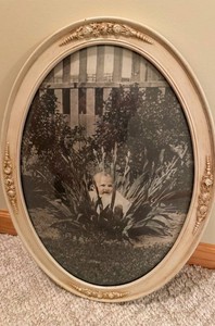 late 19th to early 20th-century antique oval frame with its original print
