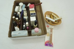 variety of beauty products including lipstick, nail polish emery boards and more