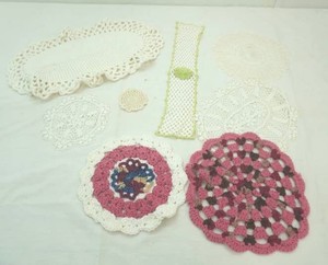 group of vintage doilies and table covers