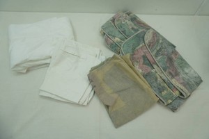 white shower curtain and patterned pillow shams