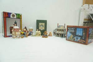 group of Christmas buildings, dog and bear figurines