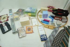 variety of household ware including becor, slippers, Avon, daily panners and more