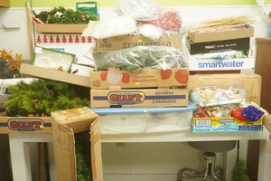 large group of Christmas decor including tinsel, figurines, greens, and much more