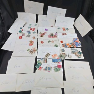 Large Vintage Worldwide Postage Stamp Collection – Country-Sorted Envelopes & 1950s Collector Guides