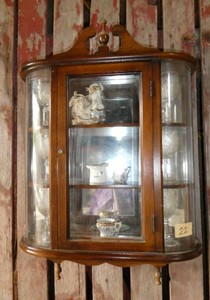 Curio cabinet with rounded sides