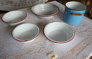 FOUR enamelware bowls and a pot