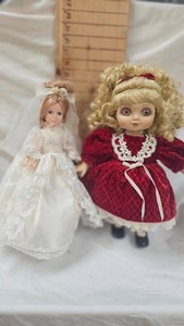 Porcelain Doll and Goldberger Honey Belle Doll on Musical Stand