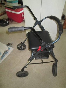 Medical assisting folding walker with storage basket seat