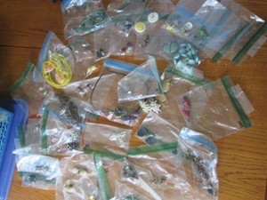 Collection costume jewelry including necklaces and earrings in varying colors, styles, metals and adornments with the possibility of precious metals