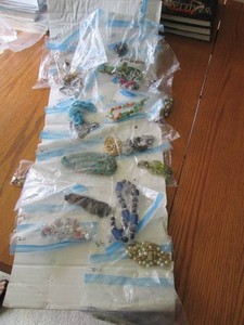 Bulk lot of mostly costume jewelry necklace pieces with the possibility of precious metals