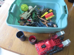Vintage collectible toy lot including GI Joe Barbie type figures, metal Tonka grader, Ertl die cast John Deere tractors, Transformers, He-man and wrestling action figures and more