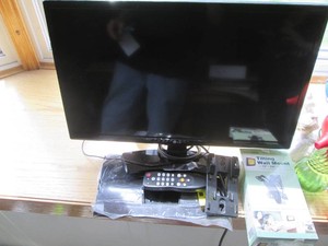 24in LG flat screen TV with remote, stand and wall mount hardware